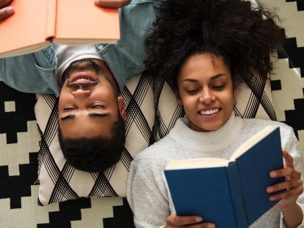 man and woman reading books