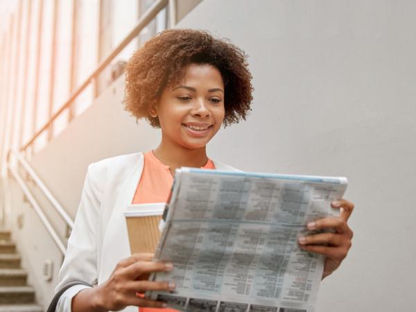 woman reading newspaper
