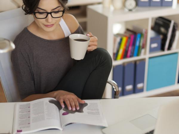 woman reading print magazine