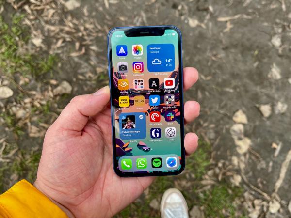 young man holding iphone