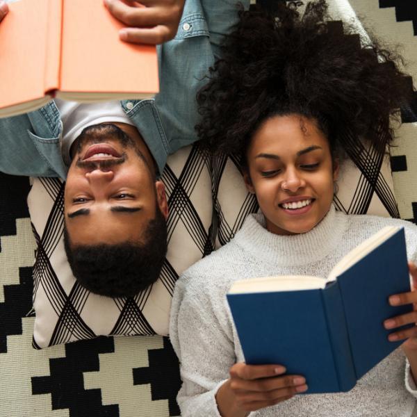 man and woman reading books