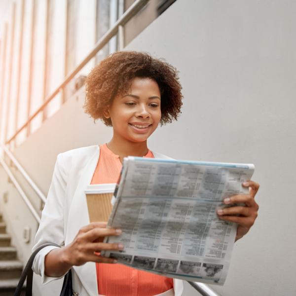 woman reading newspaper