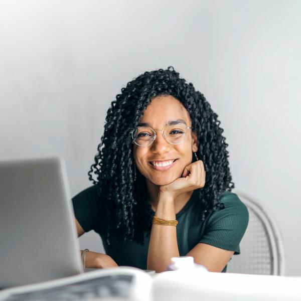 woman at desk smiling