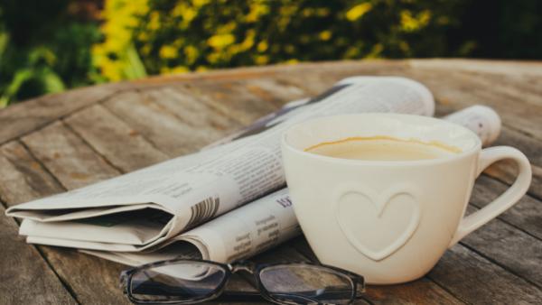 newspaper reading during coffee break