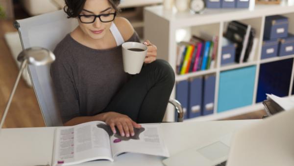 woman reading print magazine