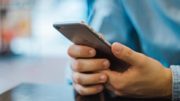 man checking mobile updates
