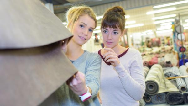 women shopping and touching clothes