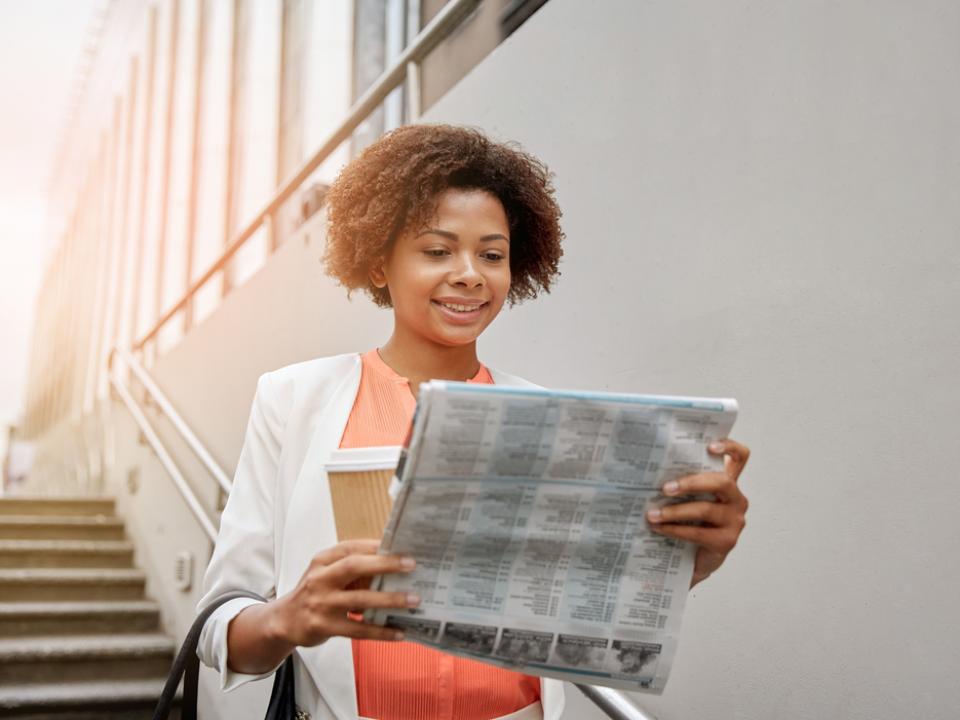 woman reading newspaper